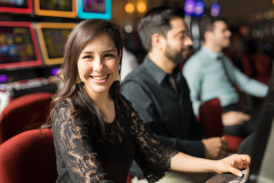 Cute woman winning in a casino
