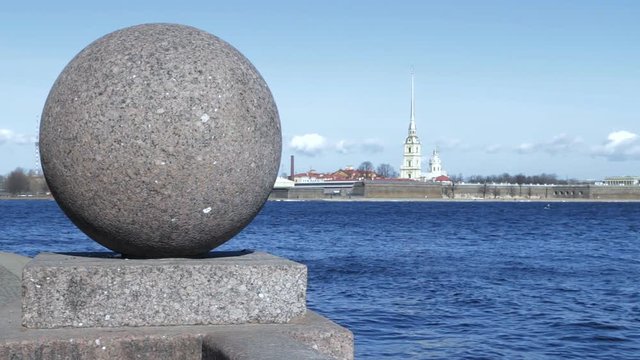 Granite embankment of river Neva in Saint Petersburg, Russia. View on Peter and Paul fortress - first city location. Spring day. Cityscape.