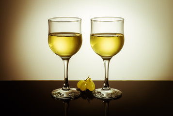 Two glasses of wine and grape berries