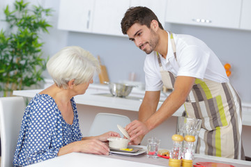 carer serving a senior lady