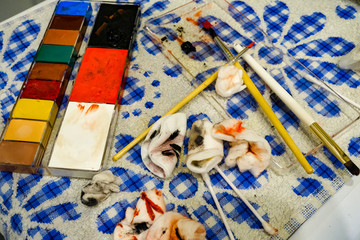 paint and make-up brushes on the table