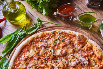 Freshly cooked pizza on the wooden table