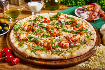 Freshly cooked pizza on the wooden table