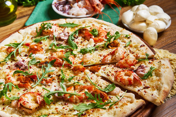 Freshly cooked cheese pizza on the wooden table
