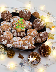 Chocolate Christmas Cookies with decoration and fir tree isolated.