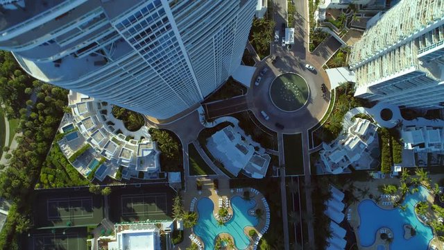 Aerial stock footage rooftop flyover highrise buildings Miami Beach South Pointe Park 4k