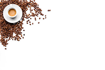 Cup of milky coffee on white table top view copyspace. Coffee background.