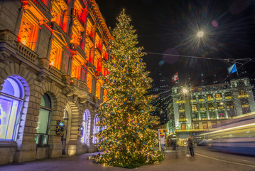 Fototapeta na wymiar Christmas shopping in the decorated Zurich Paradeplatz - 2