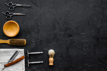 Vintage barbershop tools. Razor, sciccors, brush on black background top view copyspace