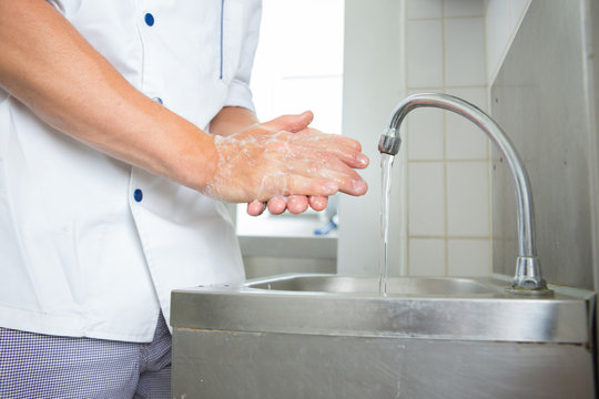 man worker washing hands