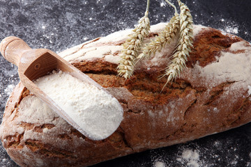 Freshly baked bread and flour in a bakery concept set