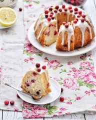 The dish is a cake with lemon and cranberries. In the sugar glaze