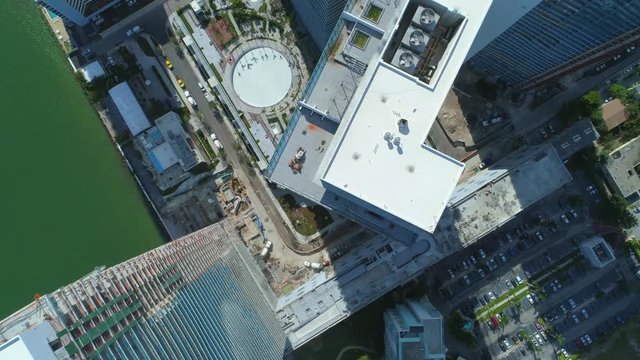 Stock video direct overhead flyover highrise buildings under construction