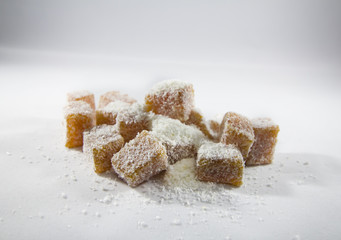 Turkish Delights on White Background with Coconut Pieces