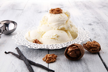 homemade oatmeal and walnut ice cream on wooden background