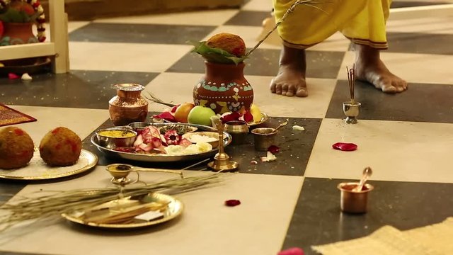 Deity installation ceremony in the Krishna temple, feet of Krishna worshipper