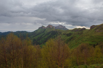 The formation and movement of clouds over the summer slopes of Adygea Bolshoy Thach and the Caucasus Mountains