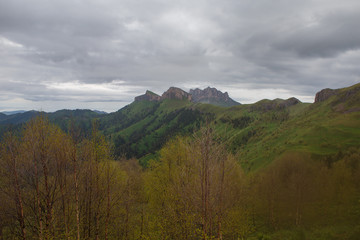 Fototapeta premium The formation and movement of clouds over the summer slopes of Adygea Bolshoy Thach and the Caucasus Mountains