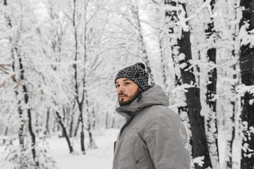 a man in a snowy forest