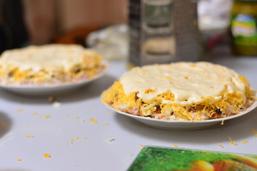 Cod liver salad with eggs, carrots, cheese, onions and potatoes. Salad with sour cream. Mimosa salad.