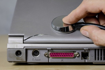 Obraz premium Computer treatment on a computer service. Repair and diagnostics of computer hardware. Computer equipment on a workshop table.