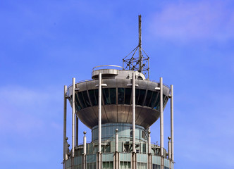 Tower of futuristic shape with a circular view and radio mast