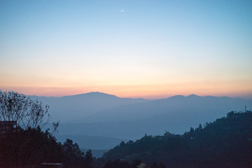 Sunrise above valley in the Himalaya mountains, Nepal