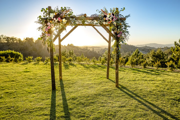 Jewish traditions wedding ceremony. Wedding canopy chuppah or huppah with the sun behind it