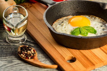 Fried eggs in a frying pan. Rustic breakfast