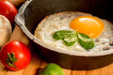 Fried eggs in a frying pan. Rustic breakfast
