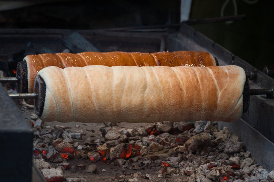 Chimney cake roasted over charcoal 
