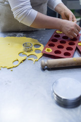 Preparing sweets , working out the dough and baking pastry in the bakery