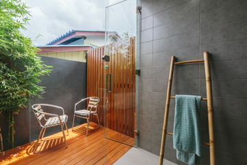Outdoor bathroom in tropical villa, bamboo ladder