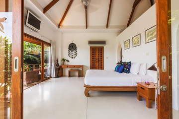Modern bed room interior in Luxury villa. White colours, big window