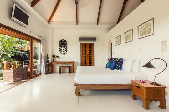 Modern bed room interior in Luxury villa. White colours, big window