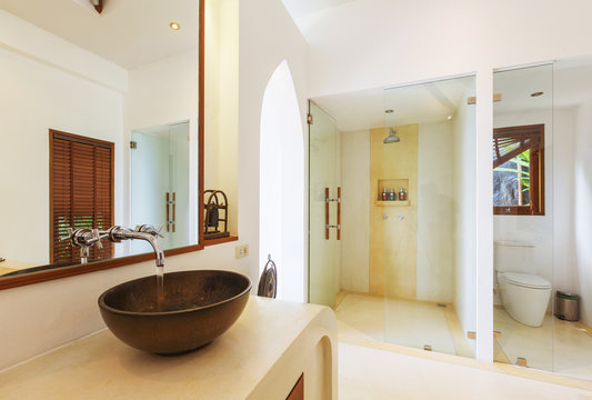 Bathroom interior in luxury villa. White colours