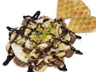 waffle with chocolate sauce served on white plate