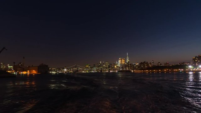 NY, USA – Moving timelapse/Hyperlapse on New York ferry at night with Manhattan skyline in view