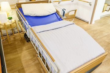 Empty hospital bed with medical equipment. Concept of medical, sickness, death