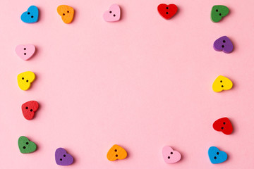 Frame of heart-shaped buttons with copy space. Valentine's day background.