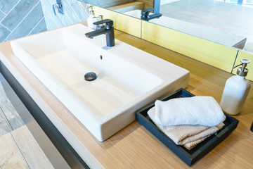 Interior of bathroom with sink basin faucet and mirror. Modern design of bathroom