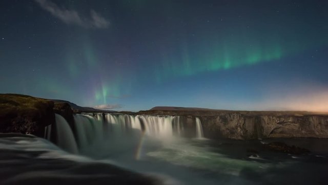 ICELAND –  2016 : Timelapse of amazing Northern Lights at Gódafoss waterfall at night with beautiful landscape in view