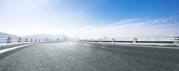 empty asphalt road with cityscape of modern city