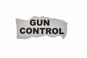 Torn paper with word Gun Control