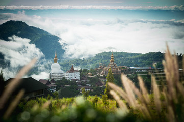 Big Buddha statue and pagoda on top of a hill with great views of the surrounding mountainous area at Wat Pha Sorn Kaew Temple in Khao Kho, Phetchabun Province, Thailand.