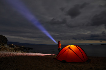 Night lit tent in camping by nature