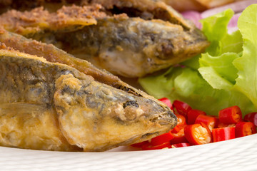 Deep-fried Sea Bass in Fish Sauce isolated on white background