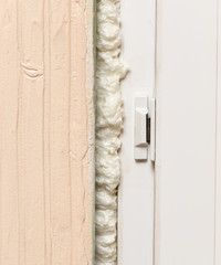 Fixing the gap in the door with construction foam