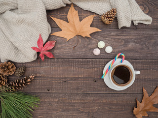 Hot coffee, bise and colorful candy on a wooden table