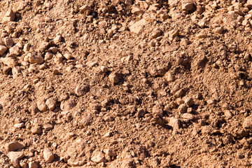 Red clay soil on nature as a background
